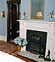View of room entrance and fireplace